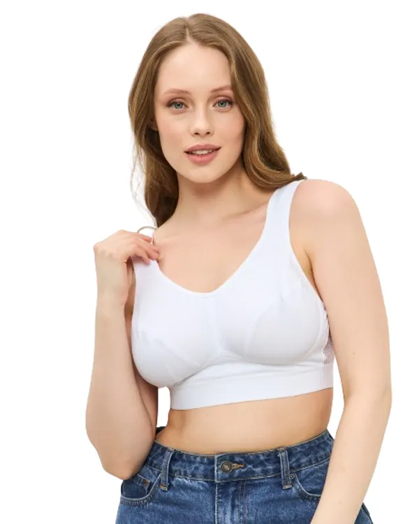 Woman wearing the white mastectomy sport bra, front view
