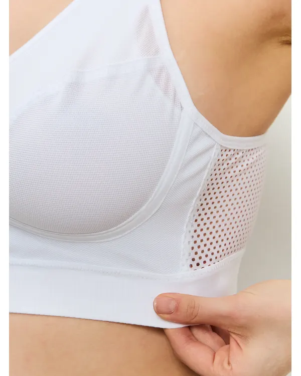 Close-up of the mesh side panel on the white mastectomy sport bra